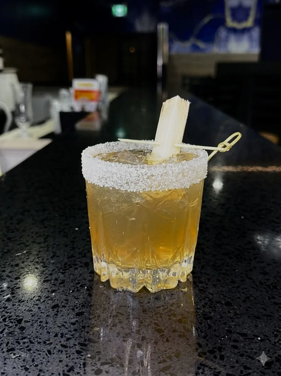 Sugarcane garnish rocks glass cocktail